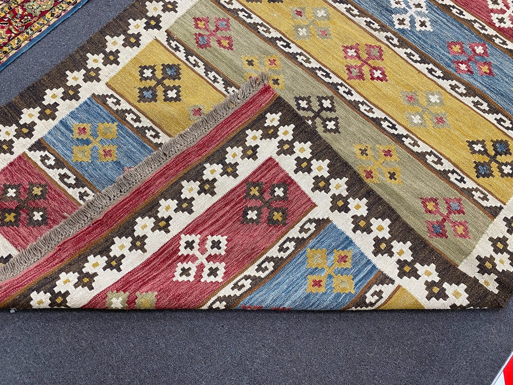 A Kilim polychrome flat weave carpet, 240 x 170cm